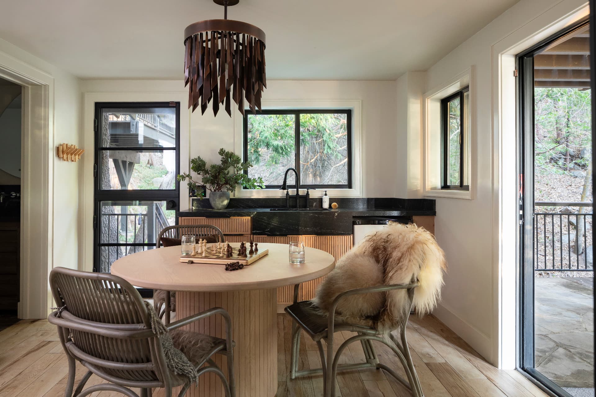Lower-level lounge with round table and bar counter
