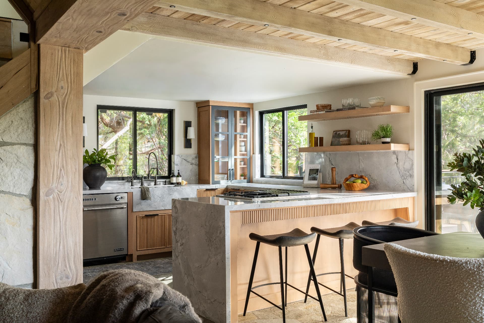 Kitchen with fluted island, dolomite countertops and timber beams